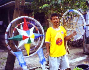 Mang Nonoy outside his home beside parols in the making